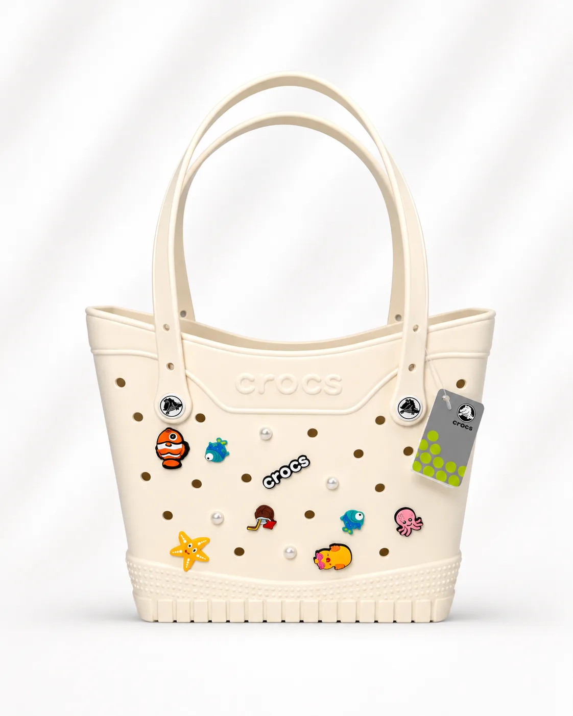 Crocs Medium Tote Bag in Bone (with sea-life Jibbitz charms)